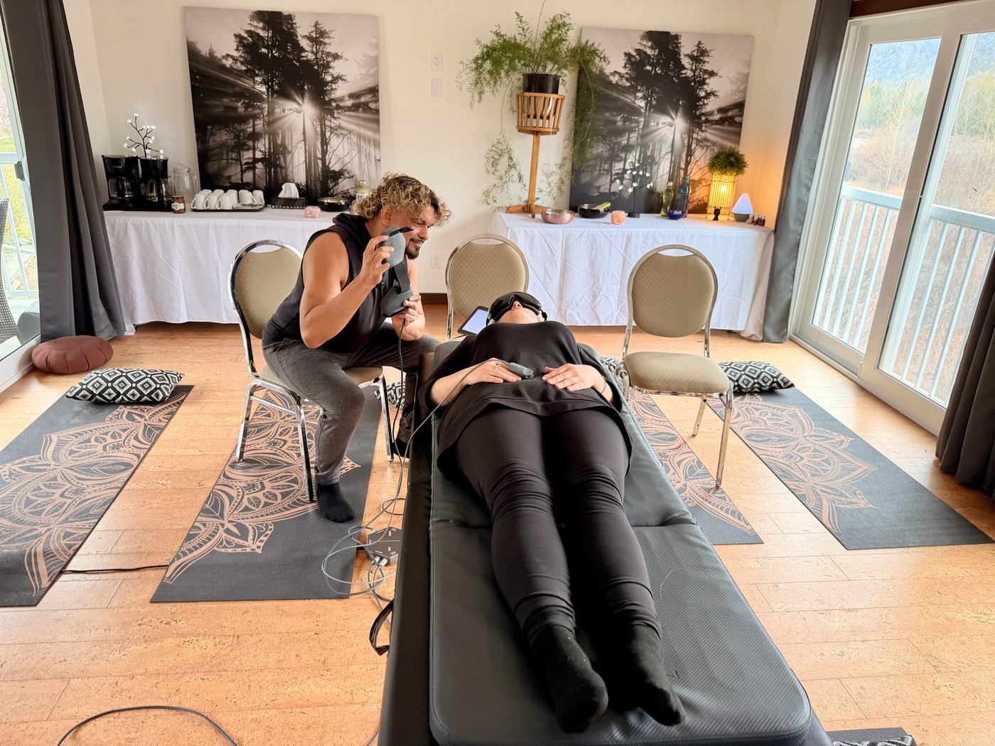 A practitioner supporting a client during a PEMF session
